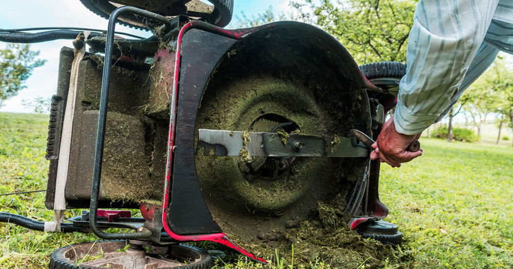 Scraping grass from mower deck | Best Home Gear
