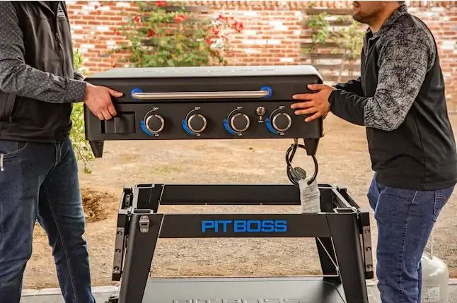 Pit Boss Ultimate Griddle Removing Portable Griddle from Stand