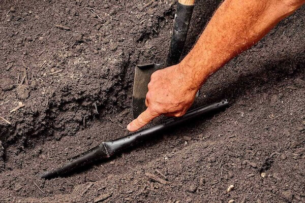 image of a crushed underground sprinkler line - best home gear