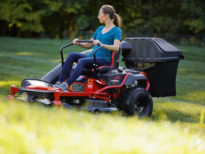 woman using troy bilt zero turn mower