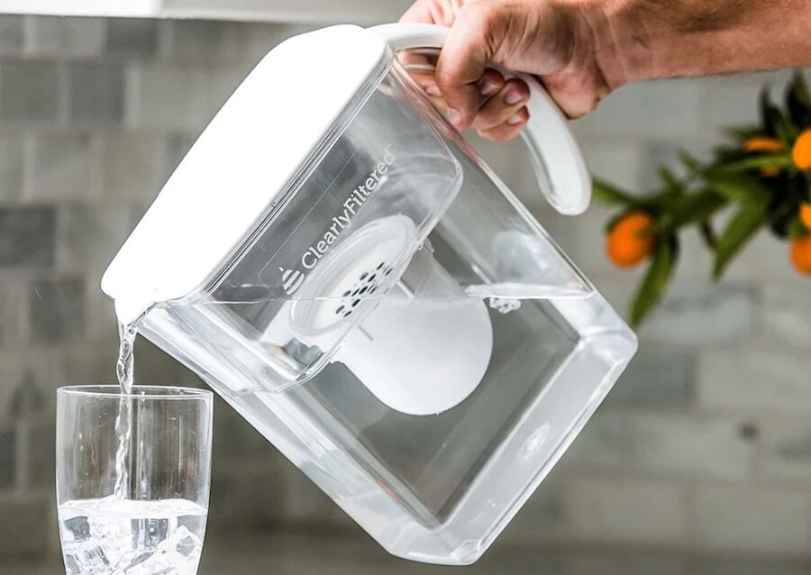 image of a person using the best water filter pitcher for home or office